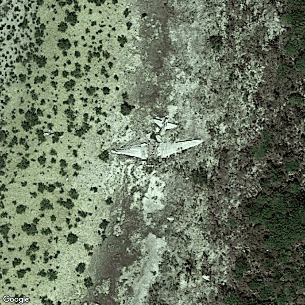 Abandoned plane resting on Bahamian land